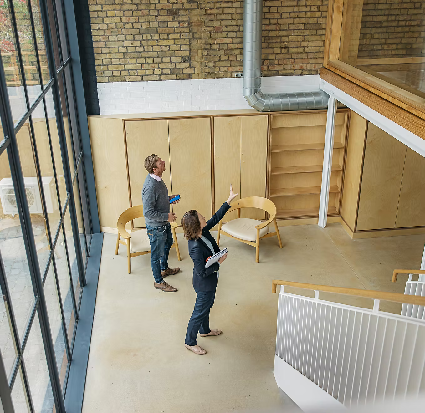 Property professionals reviewing plans at a contemporary development